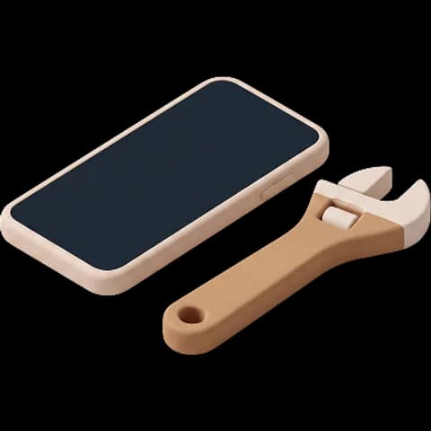 Un teléfono móvil junto a una llave inglesa